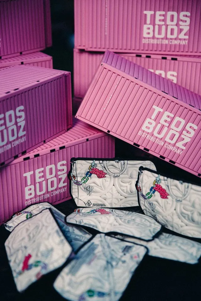 Campaign photo — stacked pink Cargo Boxes with Mellow Berry mylar bags in front