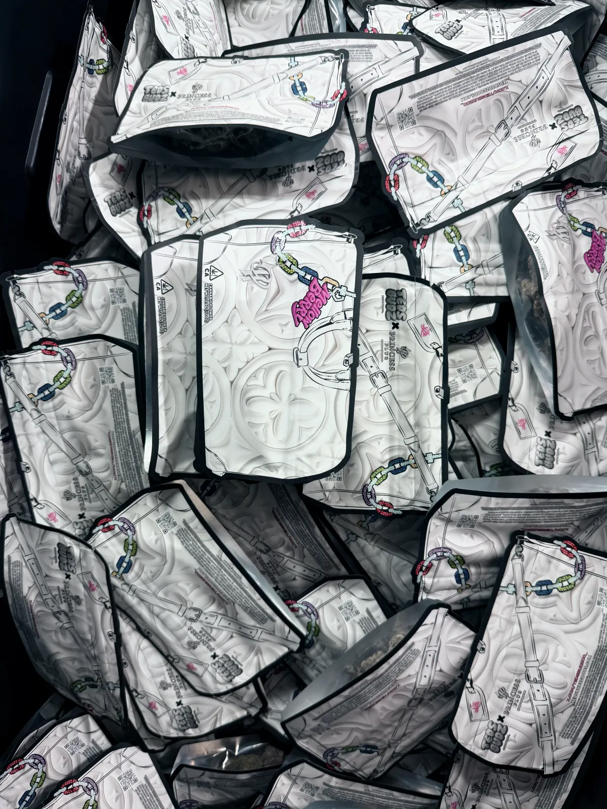 A heap of Eighth Pack mylar bags fresh off the production line